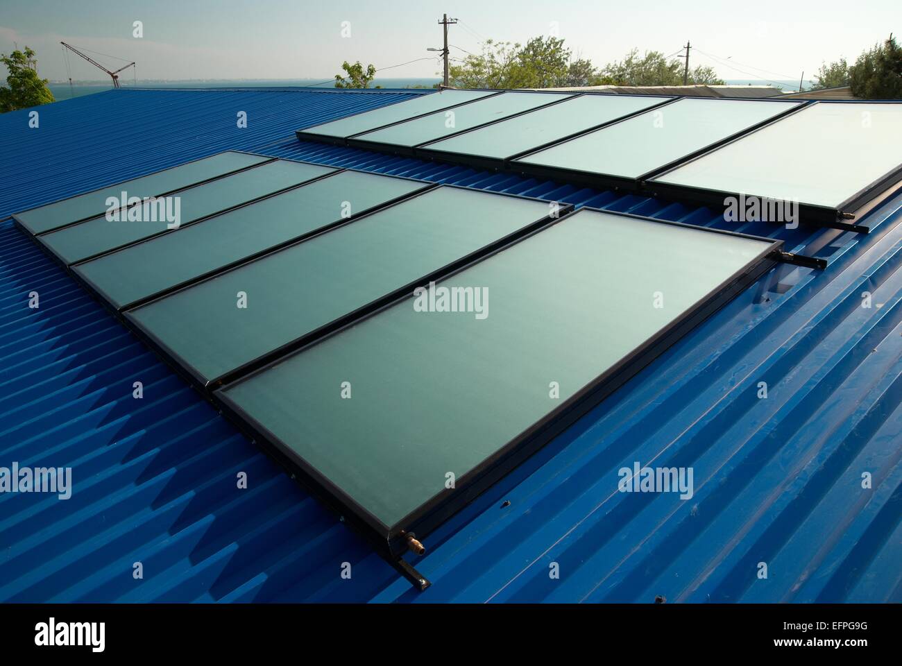 Solar water heating system on the house roof Stock Photo - Alamy