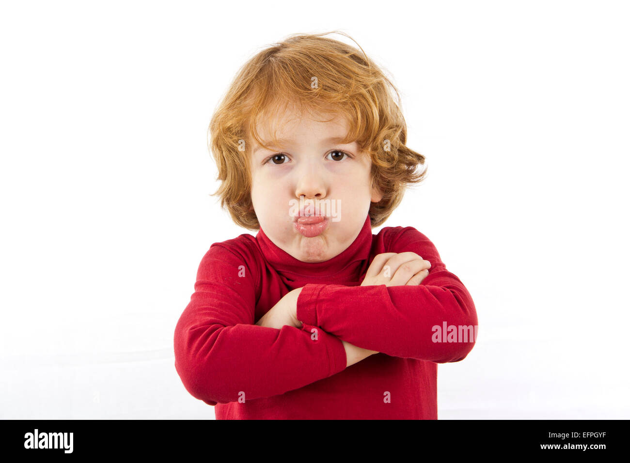 naughty child pulling out his tongue Stock Photo