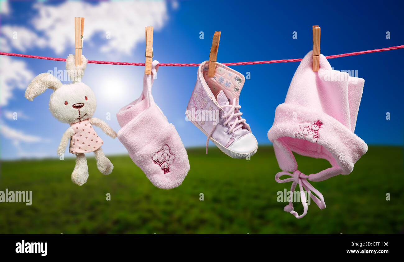 Baby clothes on the clothesline in outdoor Stock Photo