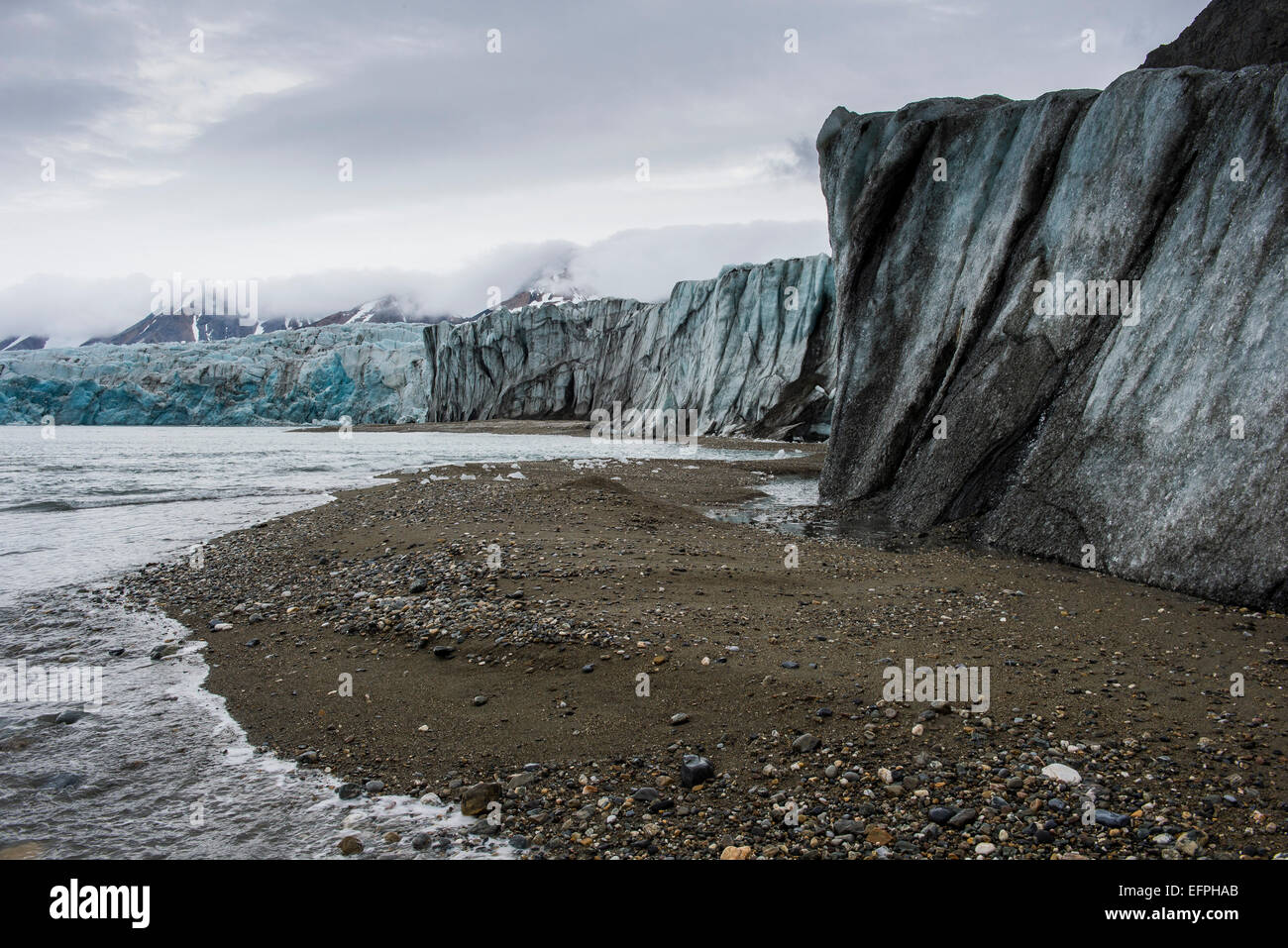 Gravel beach in front of a huge glacier in Hornsund, Svalbard, Arctic, Norway, Scandinavia, Europe Stock Photo