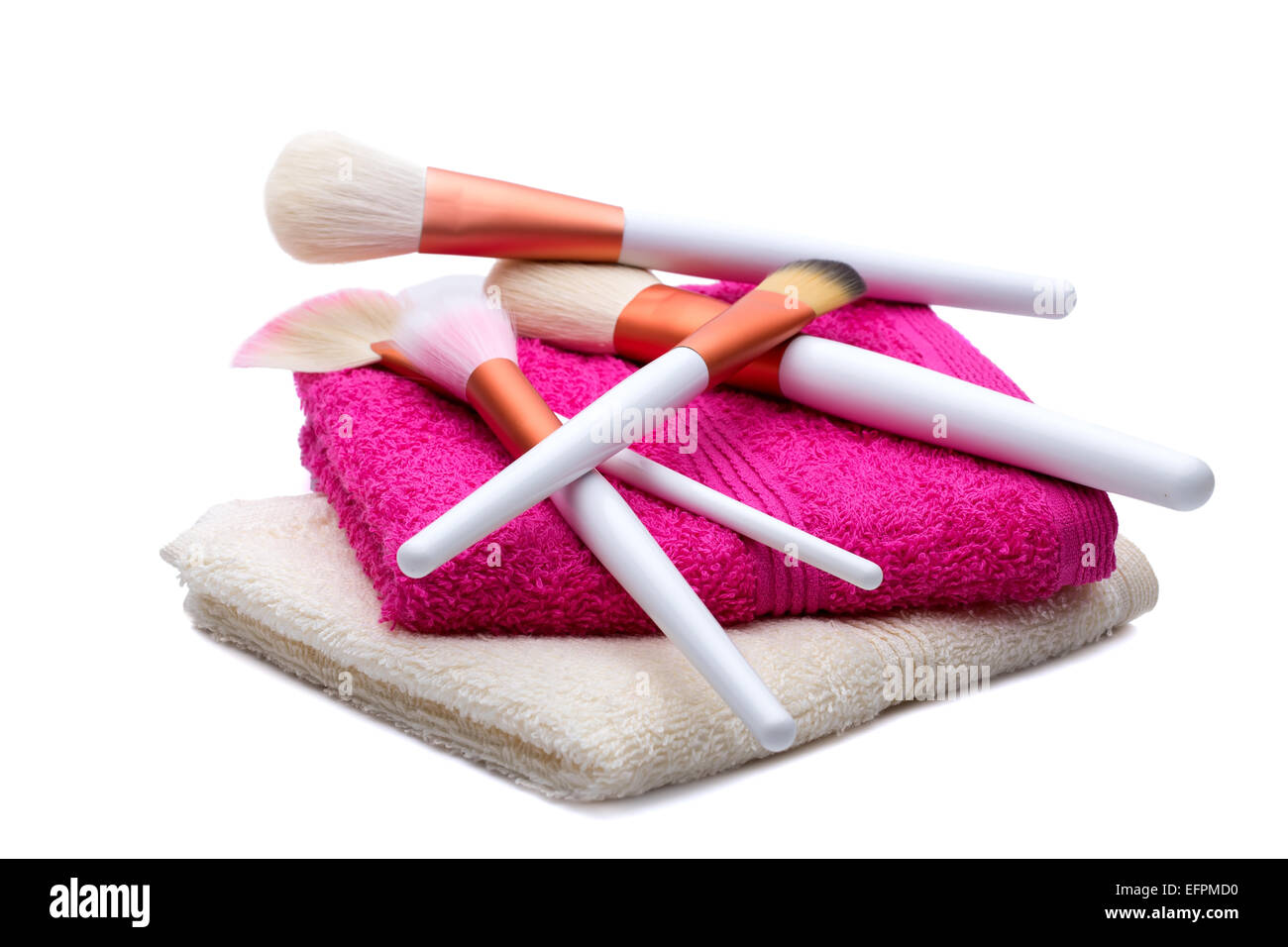 Makeup Brushes on white-pink towel Stock Photo