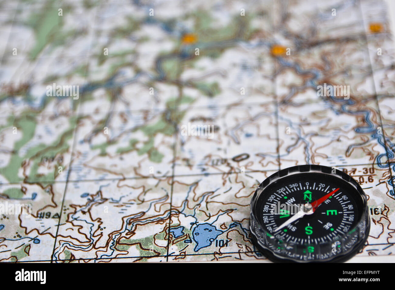 The magnetic compass is located on a topographic map. Satellites ...