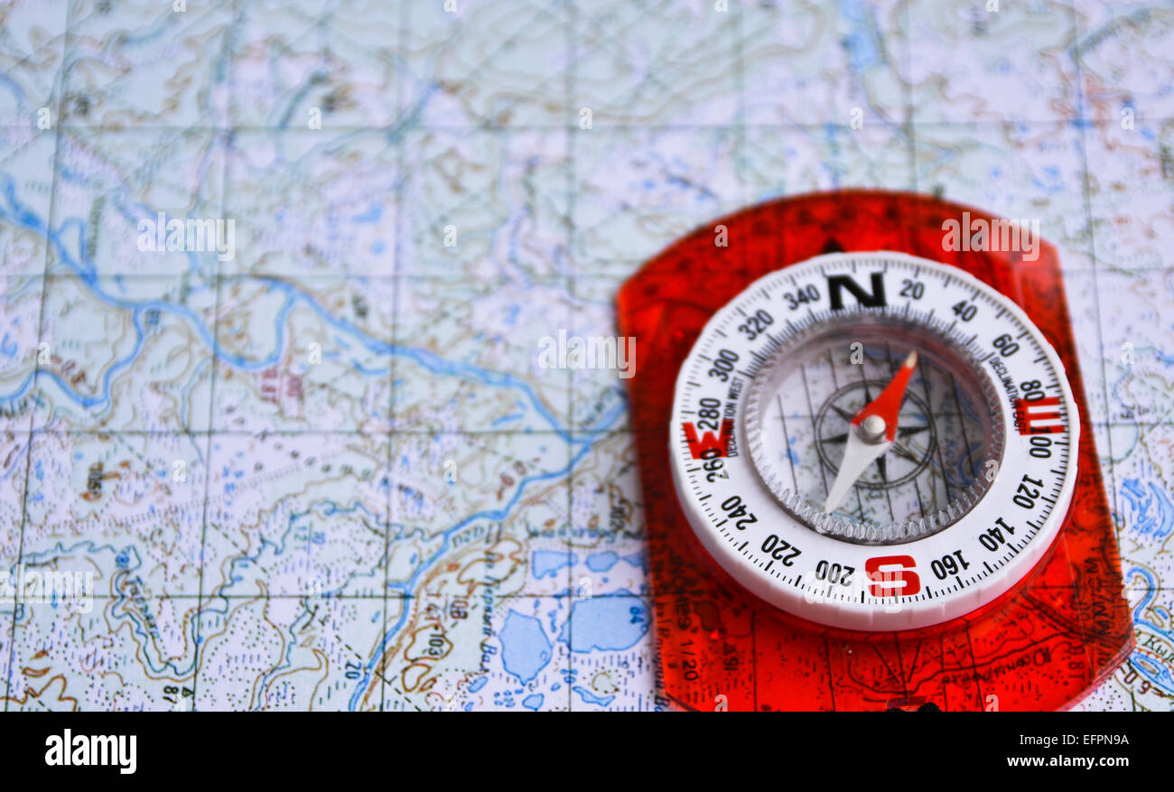 The magnetic compass is located on a topographic map. Equipment for ...