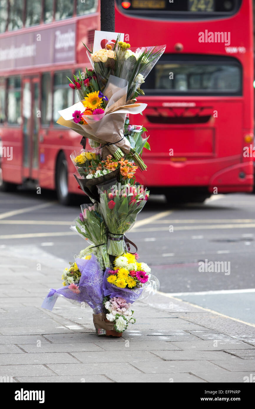 Floral tributes left at the scene of a fatal cyclist accident in central London Stock Photo