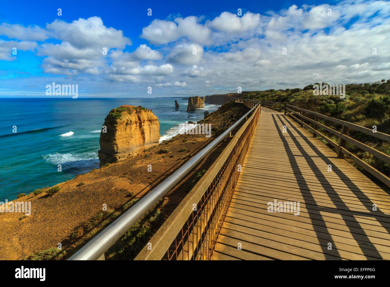 A view of the Twelve Apostles via the cliff top boardwalk. Stock Photo