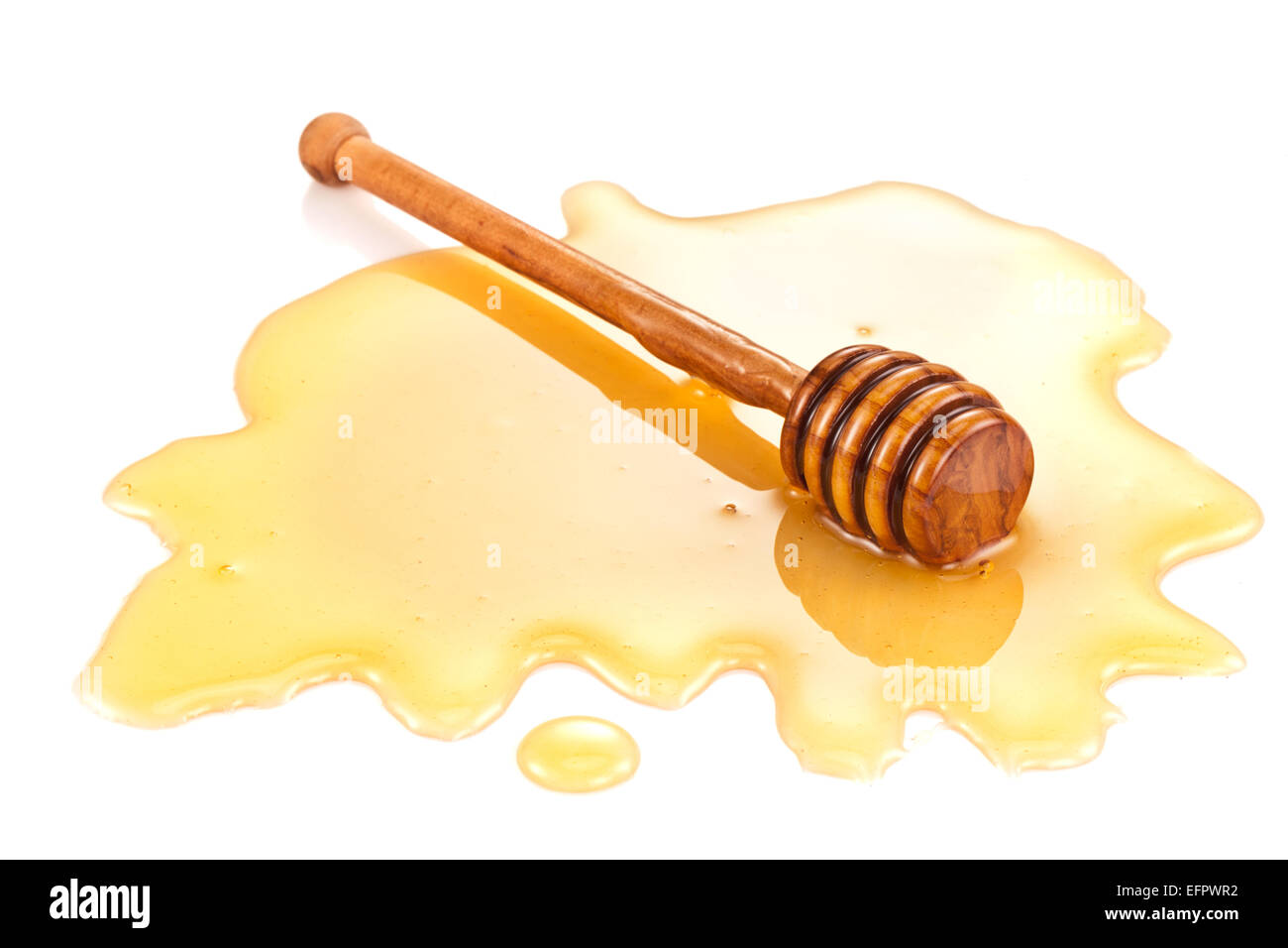 Wooden stick in the honey stain. Clipping paths. Stock Photo