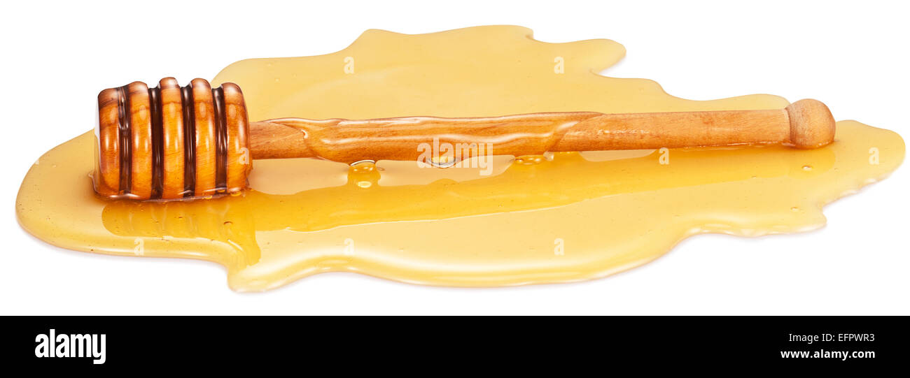 Wooden stick in the honey stain. Clipping paths. Stock Photo