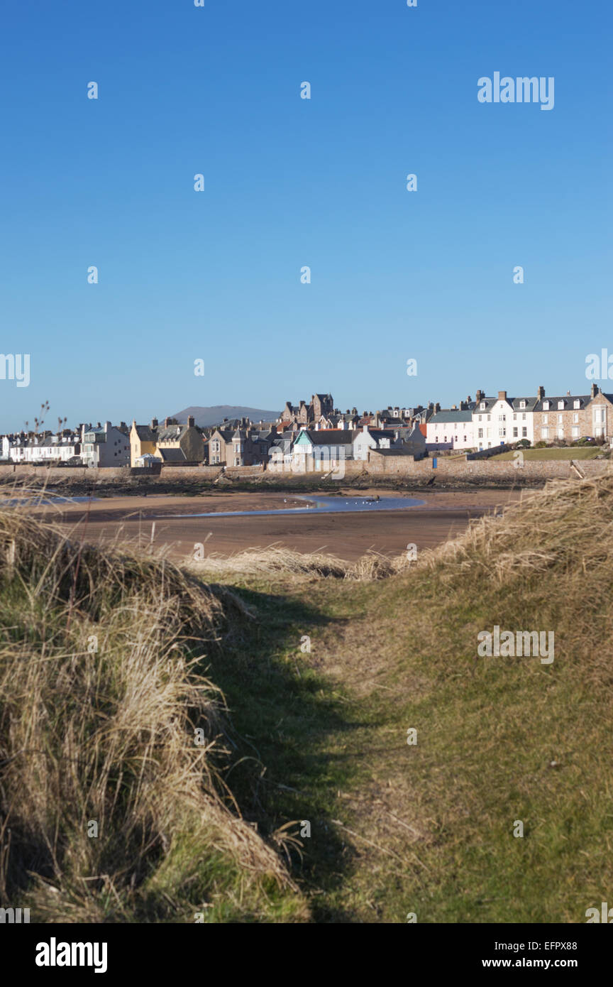 Elie beach at low tide with village through the sand dunes, Elie, East