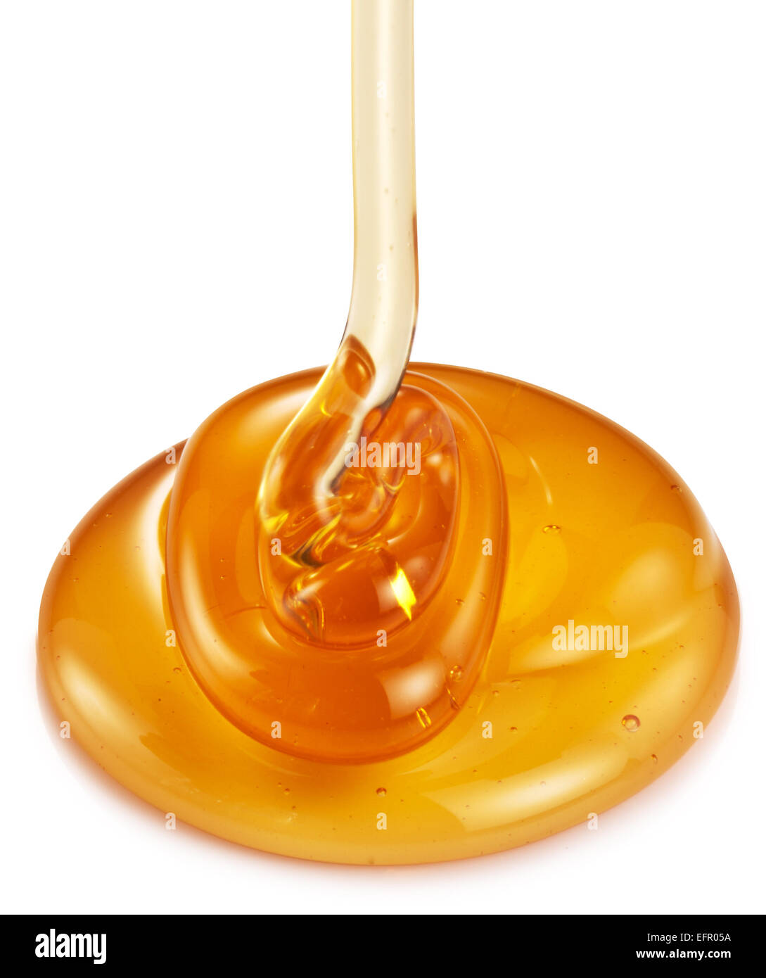 Honey flowing on white background. Clipping paths. Stock Photo