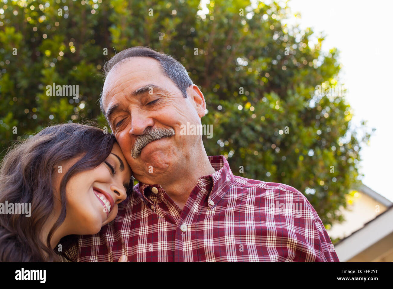 Father and daughter sharing tender moment Stock Photo