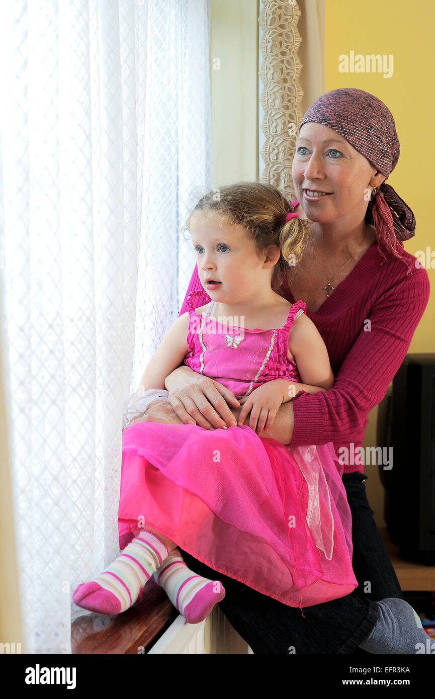 A woman sat with her daughter during chemotherapy treatment for Leukaemia. Stock Photo