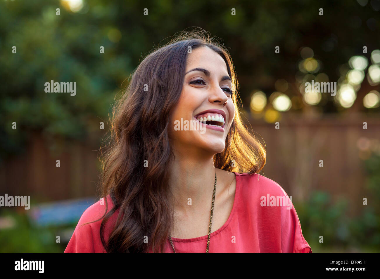 Portrait of young woman with wide smile Stock Photo