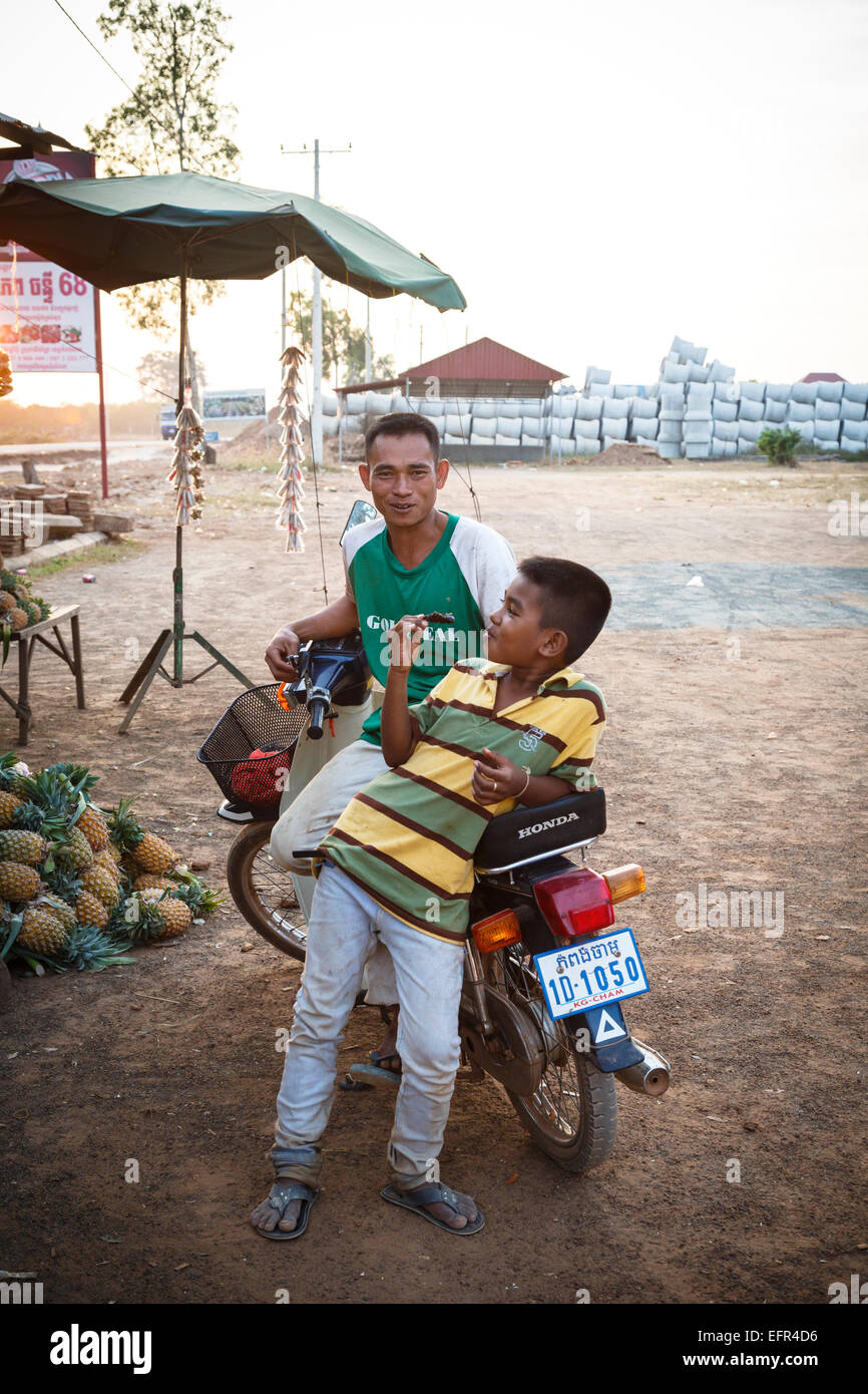 Two young men on a scooter outside Siem Reap, Cambodia. Stock Photo