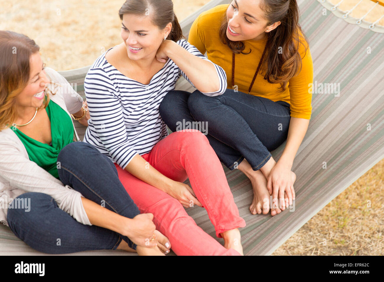 Women sitting on hammock Stock Photo
