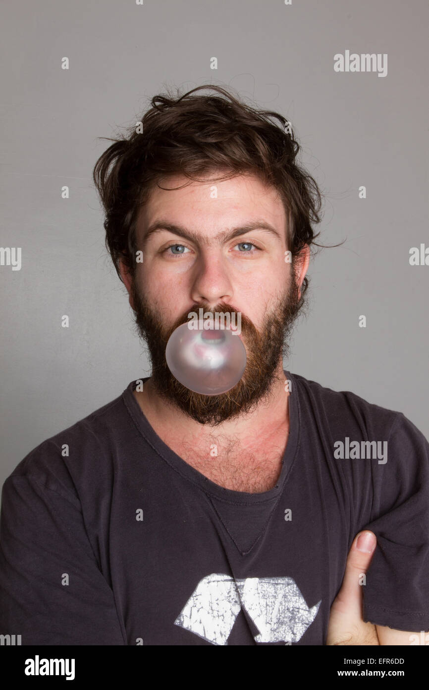 Man blowing a bubble gum bubble Stock Photo