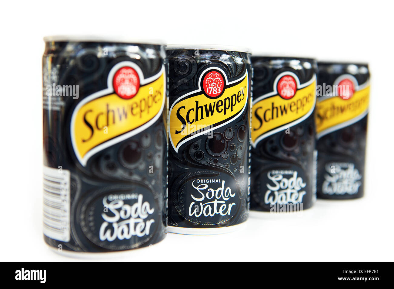 Cans of Schweppes soda white isolated on a white background Stock Photo