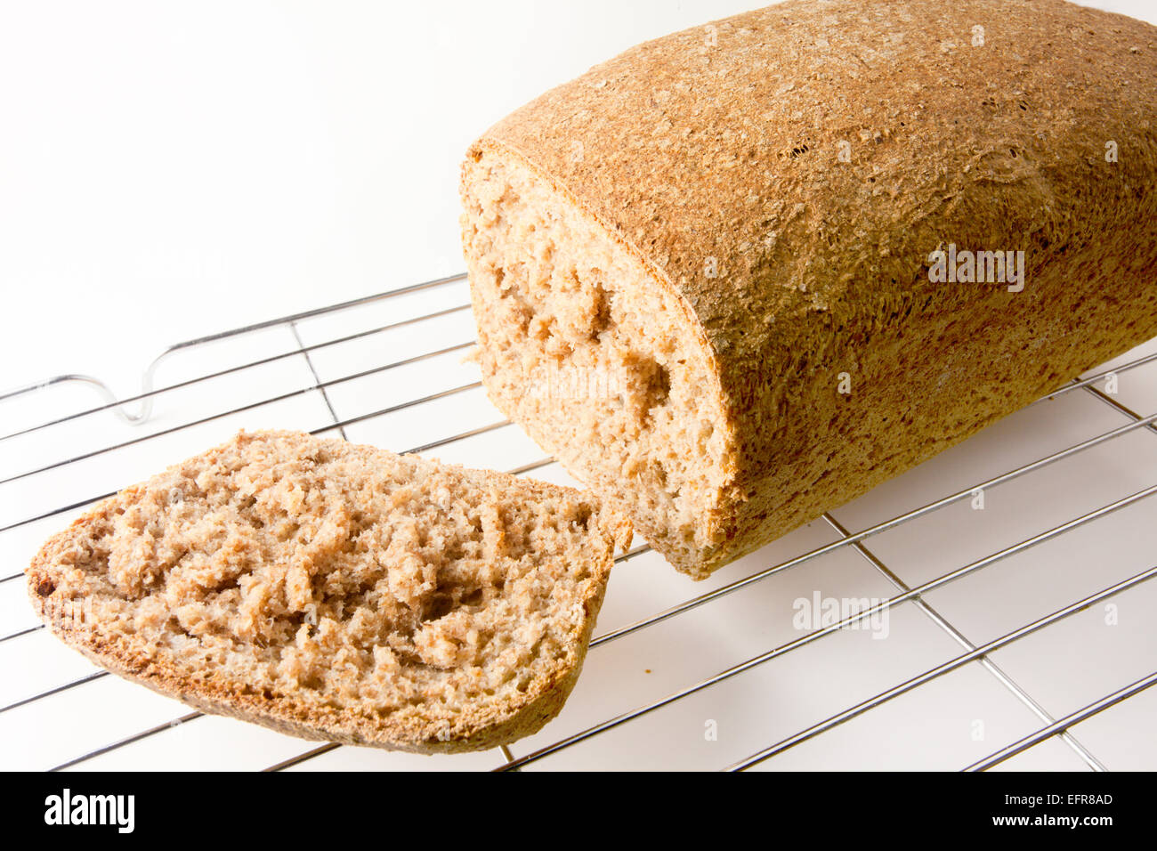 Crust Cut from Freshly Baked Wholemeal Loaf on a Wire Cooling Rack Stock Photo