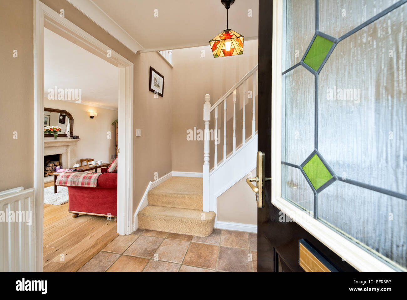 A welcoming, open front door leading in to a typical, modern, UK home Stock Photo