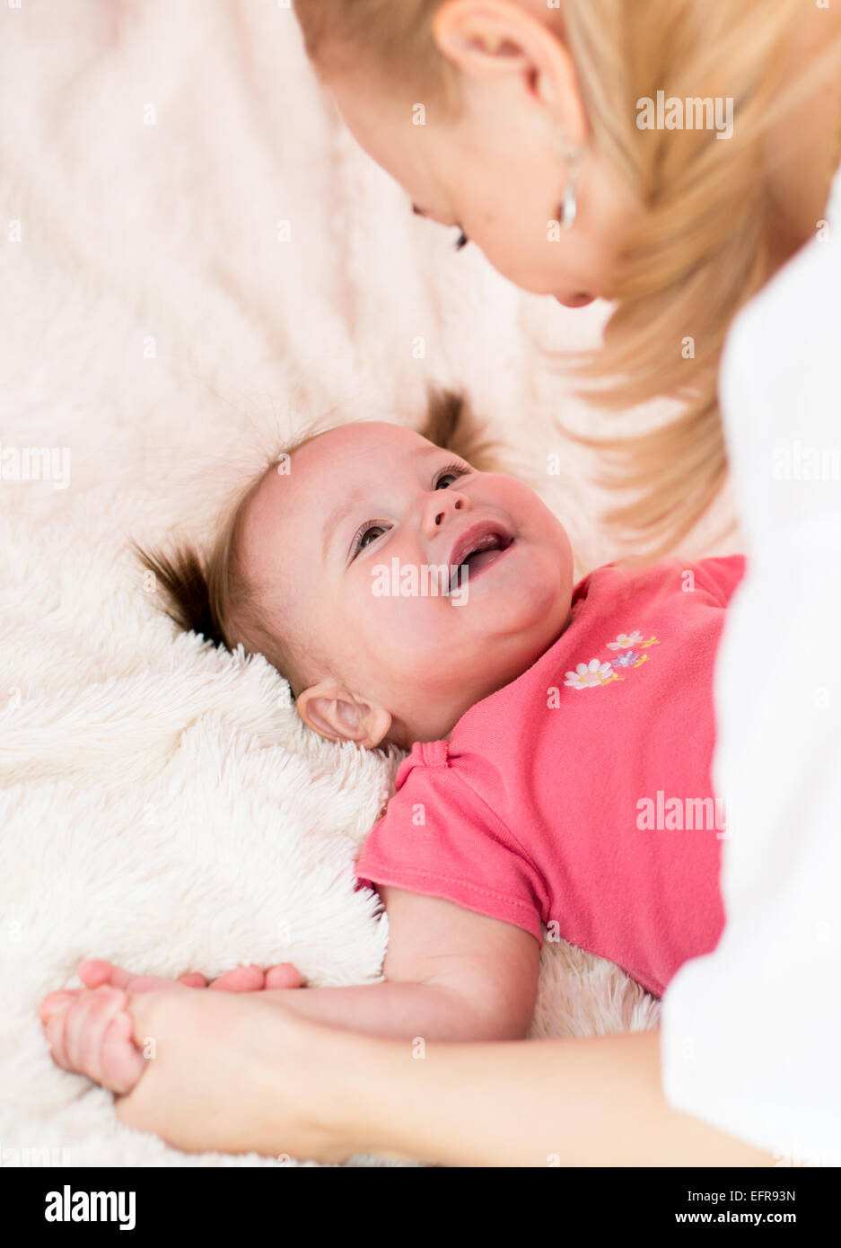 Happy mother  and baby have fun pastime Stock Photo