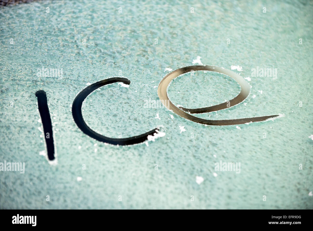 The word ice written on a frosty glass windscreen Stock Photo