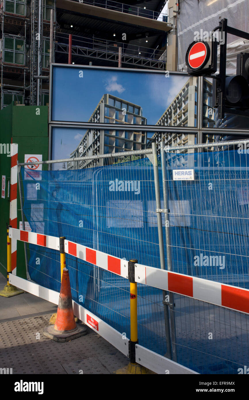 A street corner where temporary construction fencing and disruption has blocked off a City of London street. Stock Photo