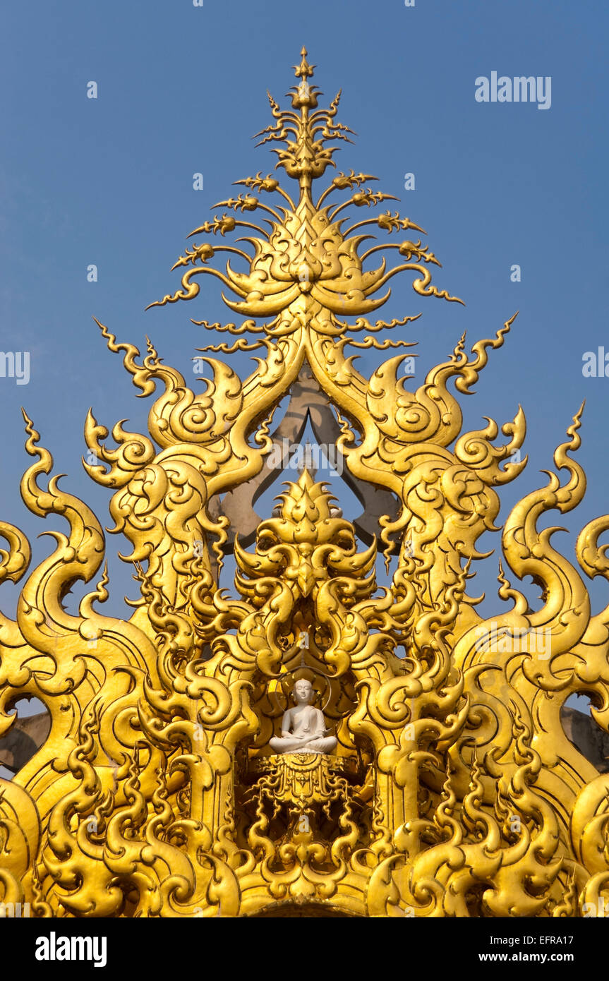 Vertical view of gold ornamentation at Wat Rong Khun, the White Temple, in Chiang Rai. Stock Photo