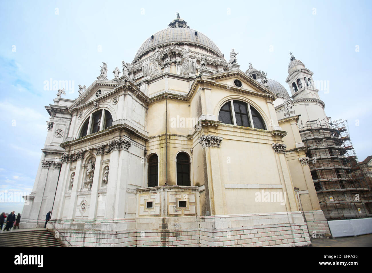 A low angle view of the Santa Maria della Salute church and people ...