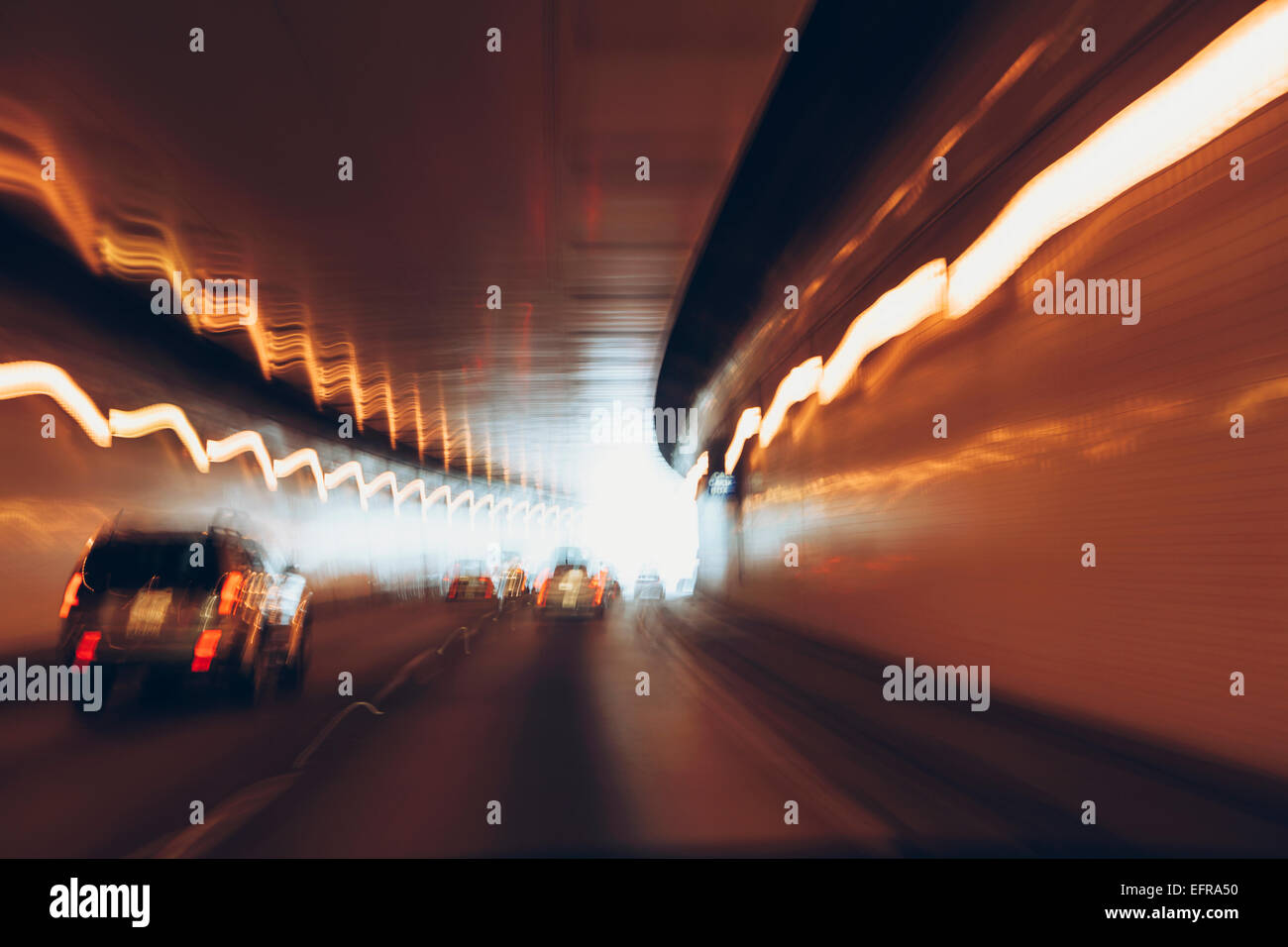 Cars driving through tunnel, long exposure Stock Photo