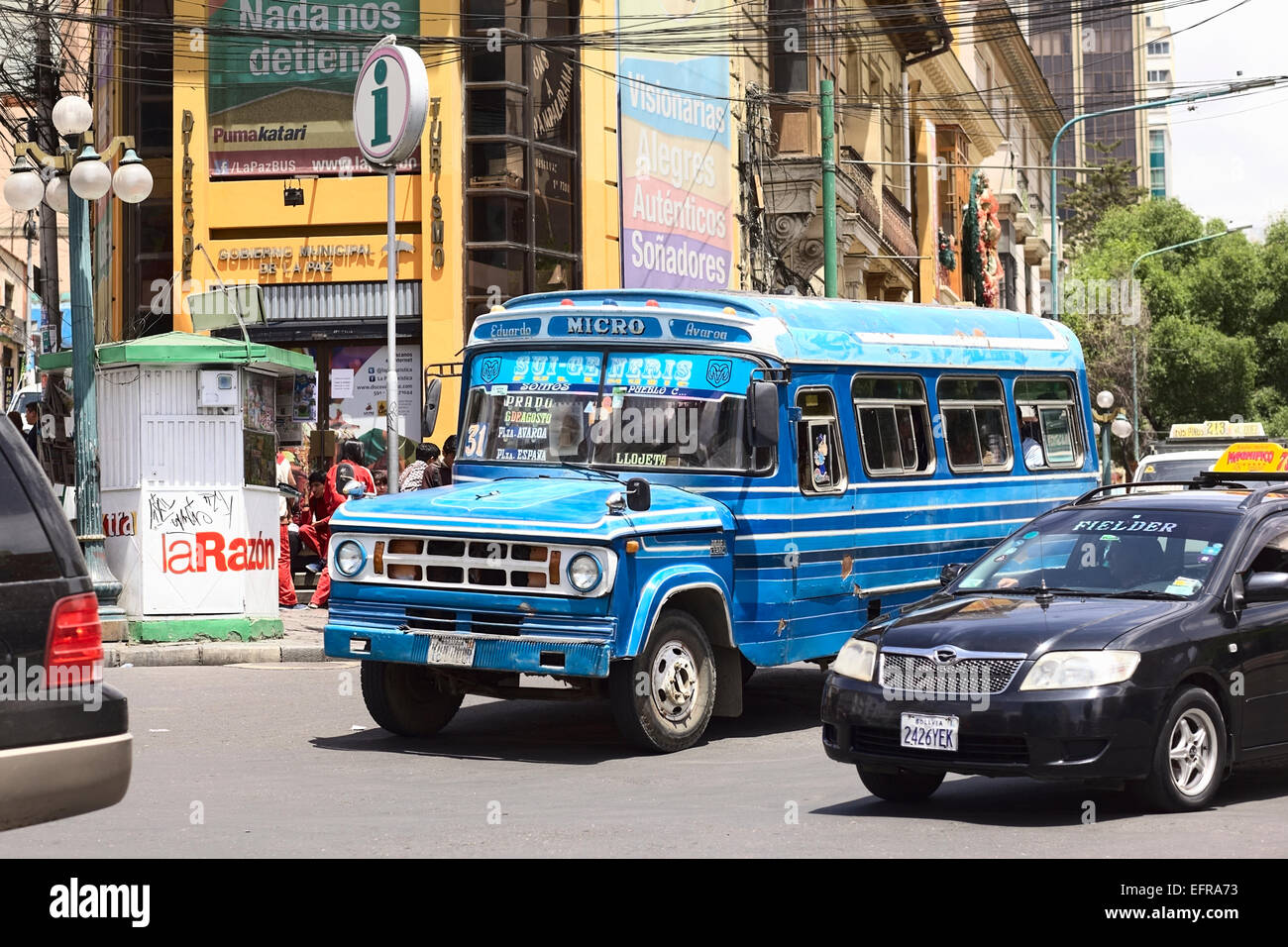 Old blue Dodge D400 bus with other cars on the Plaza del Estudiante (Student's Square) in La Paz, Bolivia Stock Photo