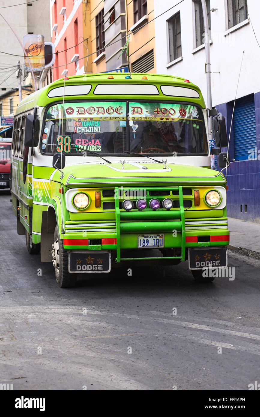 Old Dodge D400 bus used for public transportation driving in the city center in La Paz, Bolivia Stock Photo