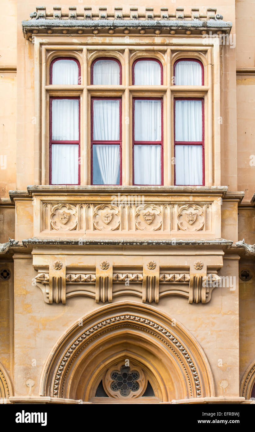 Architectural detail of a beautiful classic Gothic architecture on a house in the old city of Mdina in Malta at Pjazza San Pawl. Stock Photo
