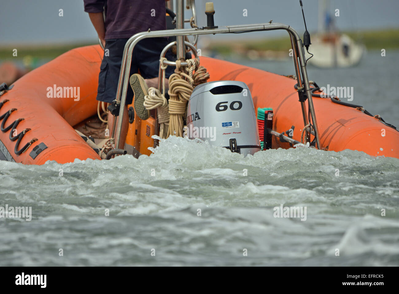 Submerged outboard motor on dingy Stock Photo