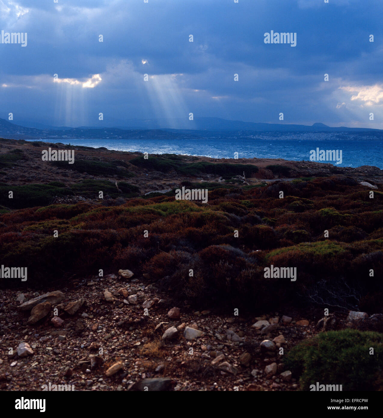 Sunrays from clouds in Sitia bay Stock Photo