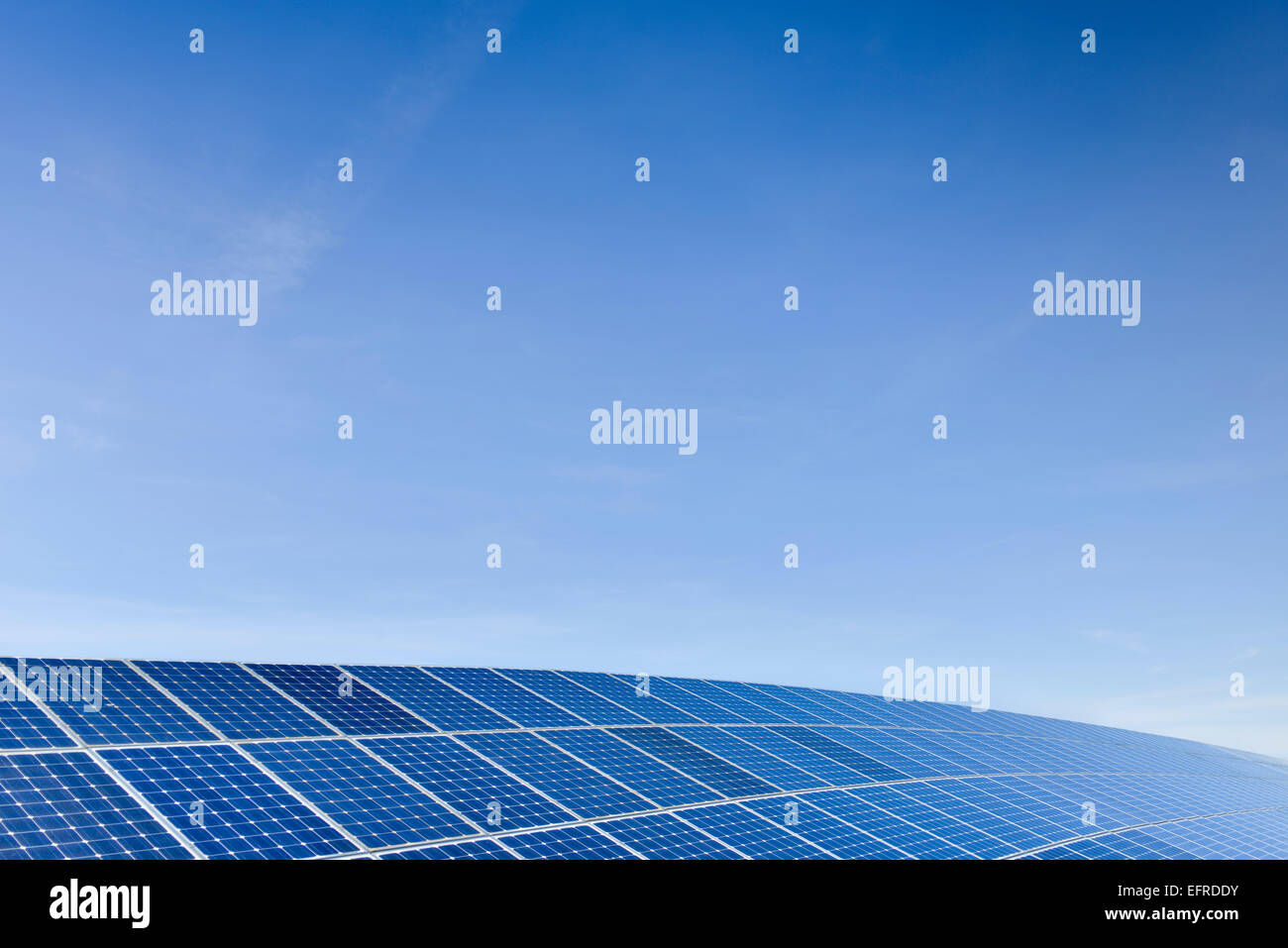 Solar Panels Against The Deep Blue Sky Stock Photo - Alamy