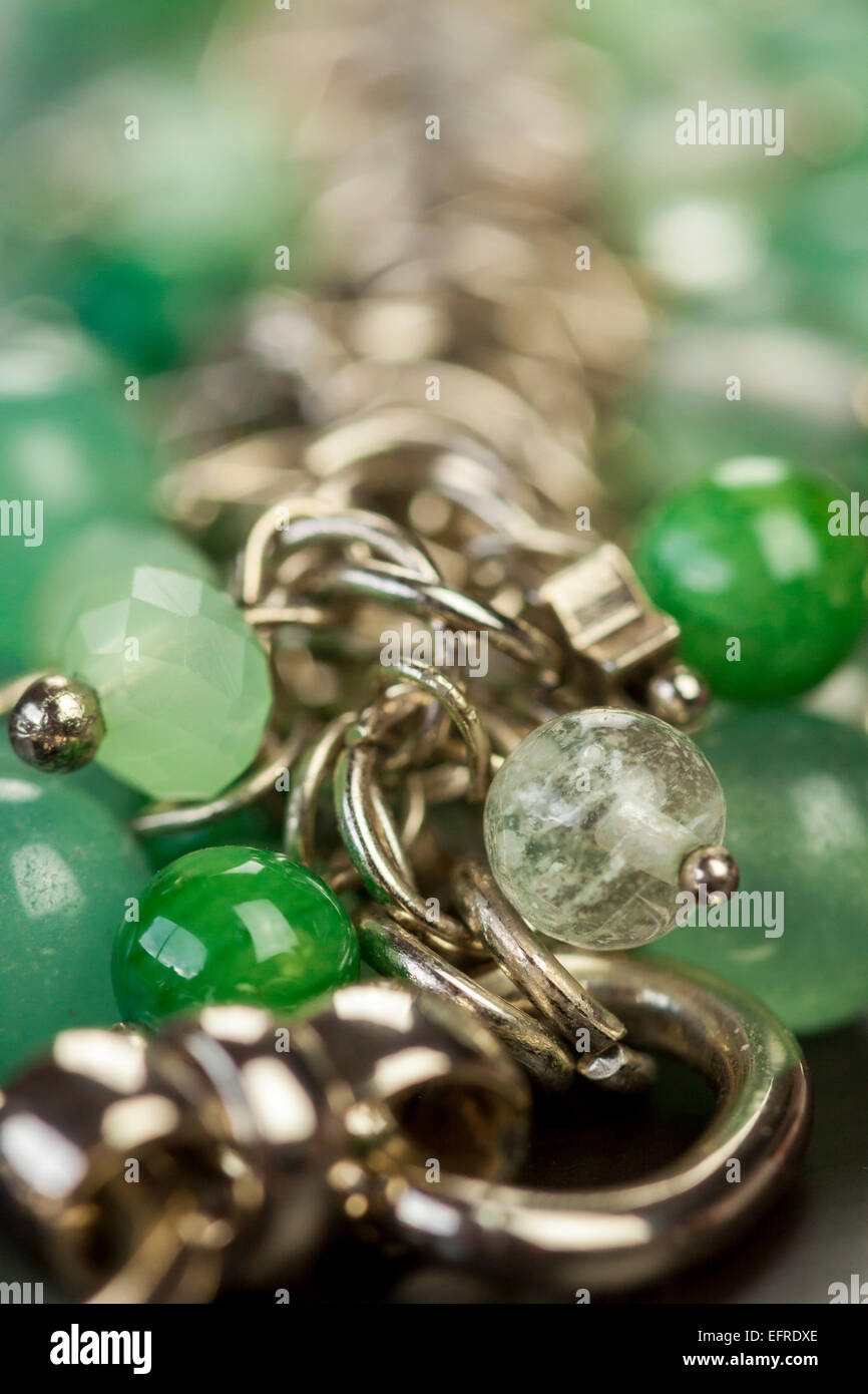 Assorted silver costume jewellery with a jumbled pile of chains with