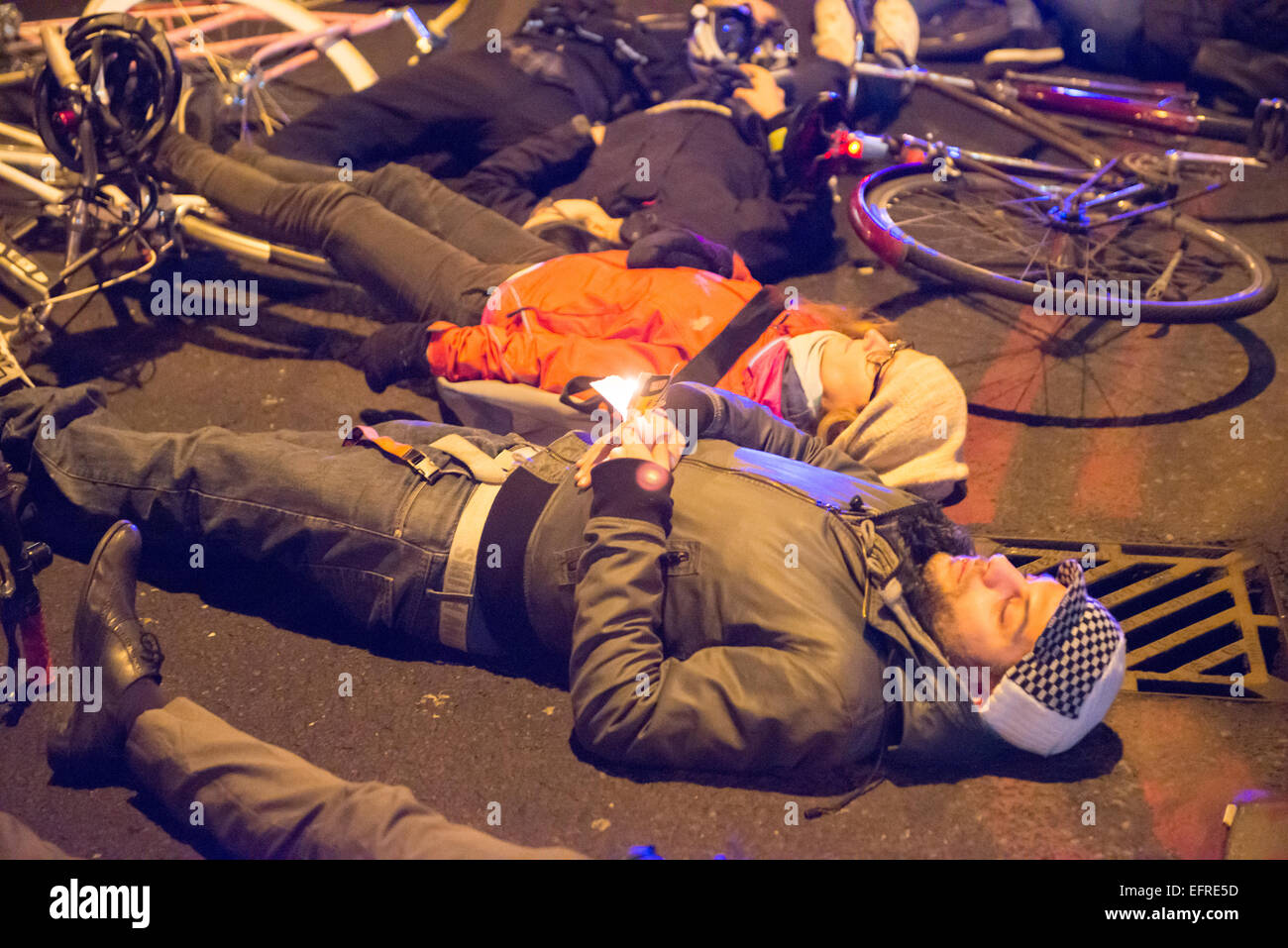 Homerton High Street, Hackney, London, UK. 9th February 2015. A 'Die In' is held in Homerton High St at the spot where cyclist Akis Kollaros 34, died. Credit:  Matthew Chattle/Alamy Live News Stock Photo
