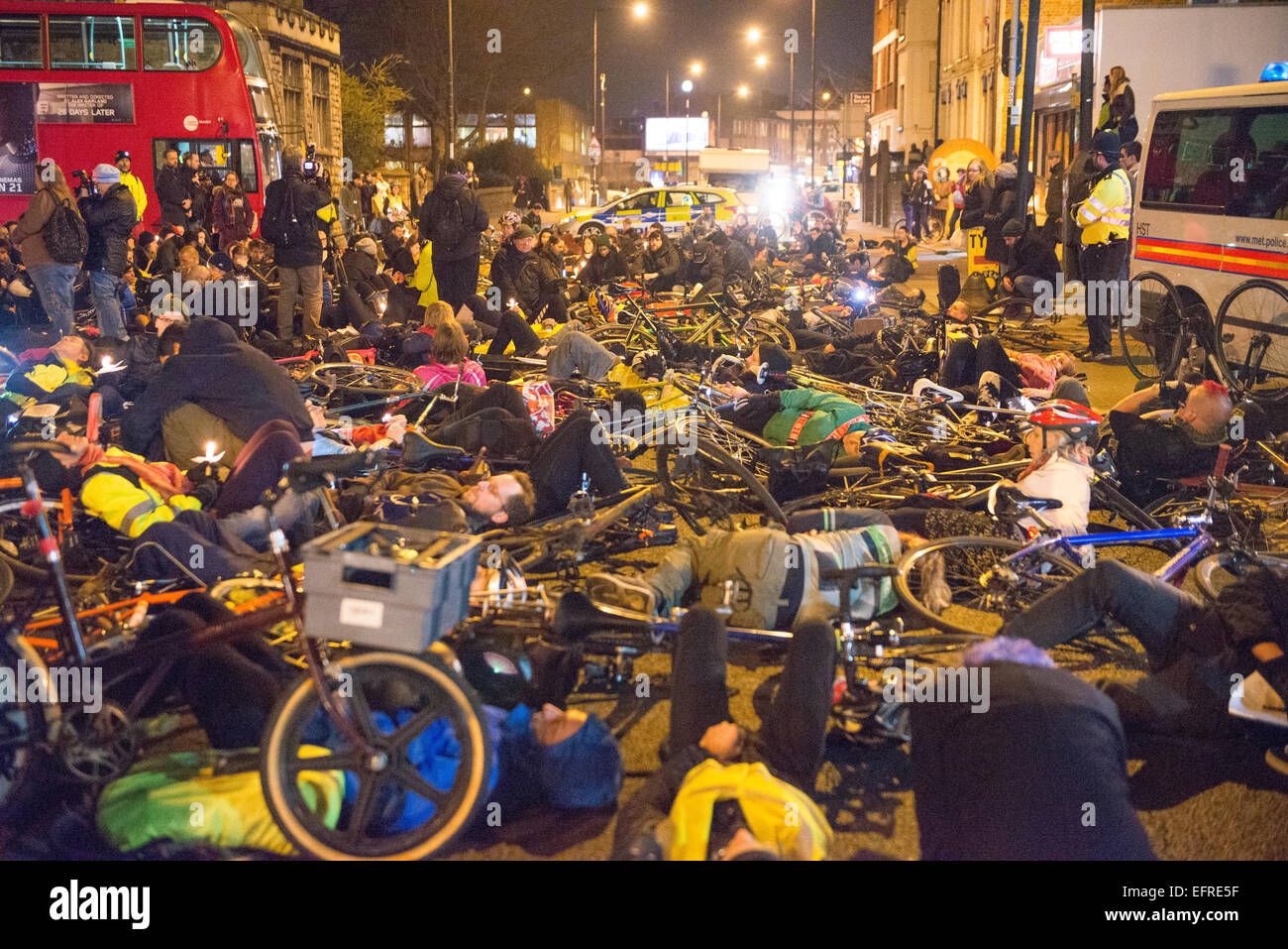 Homerton High Street, Hackney, London, UK. 9th February 2015. A 'Die In' is held in Homerton High St at the spot where cyclist Akis Kollaros 34, died. Credit:  Matthew Chattle/Alamy Live News Stock Photo