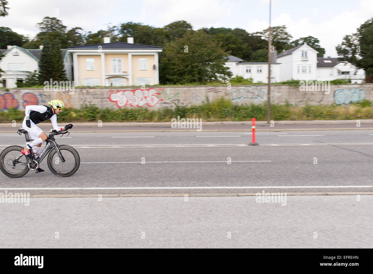 Bicyclist at the ironman 2014 on the street north of Copenhagen Stock Photo