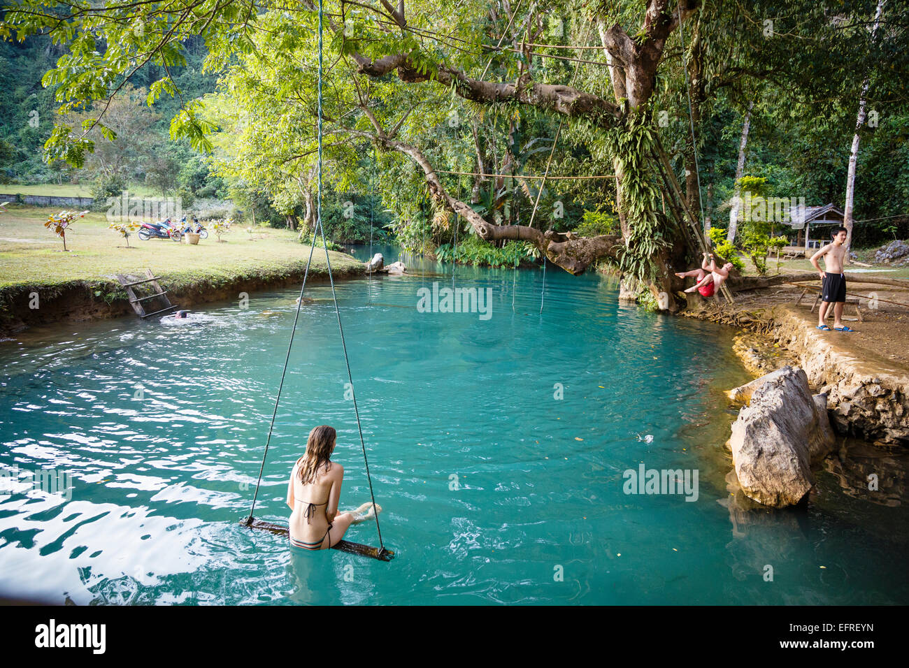 Woman on a swing in the Blue Lagoon, Vang Vieng, Laos Stock Photo Alamy
