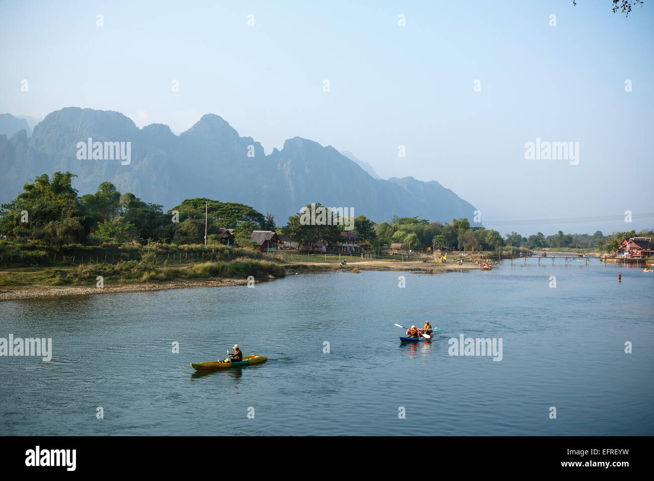 People kayaking at Nam Song river, Vang Vieng, Laos. Stock Photo