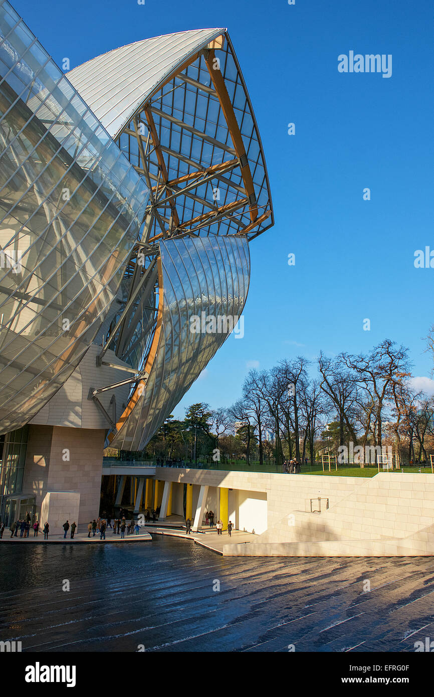 View of the Fondation Louis Vuitton museum, designed by Frank Gehry, with  colorful glass panes designed by Daniel Buren Stock Photo - Alamy
