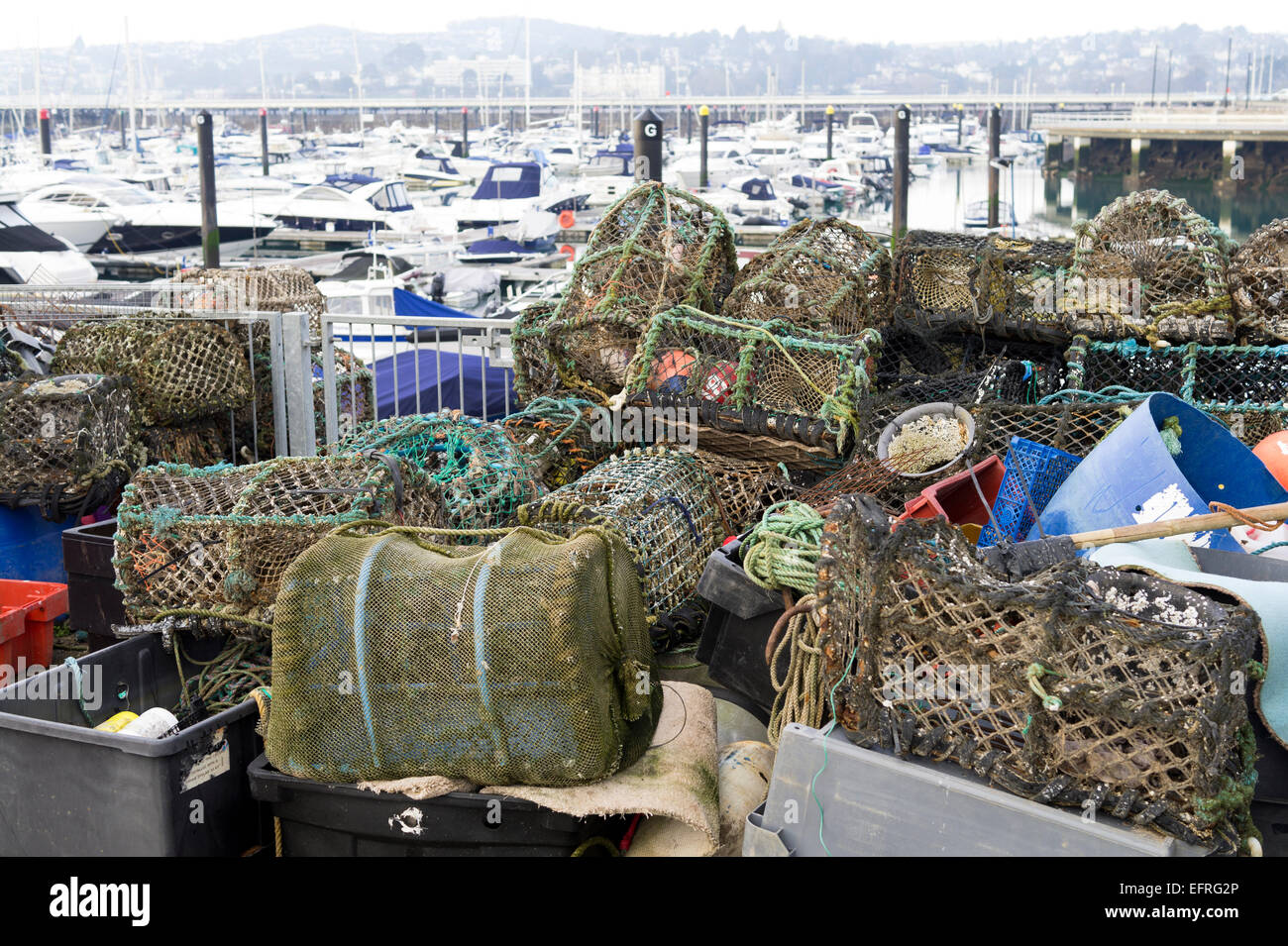 Fishing industry nets pots and equipment at Torquay harbour Devon Stock Photo