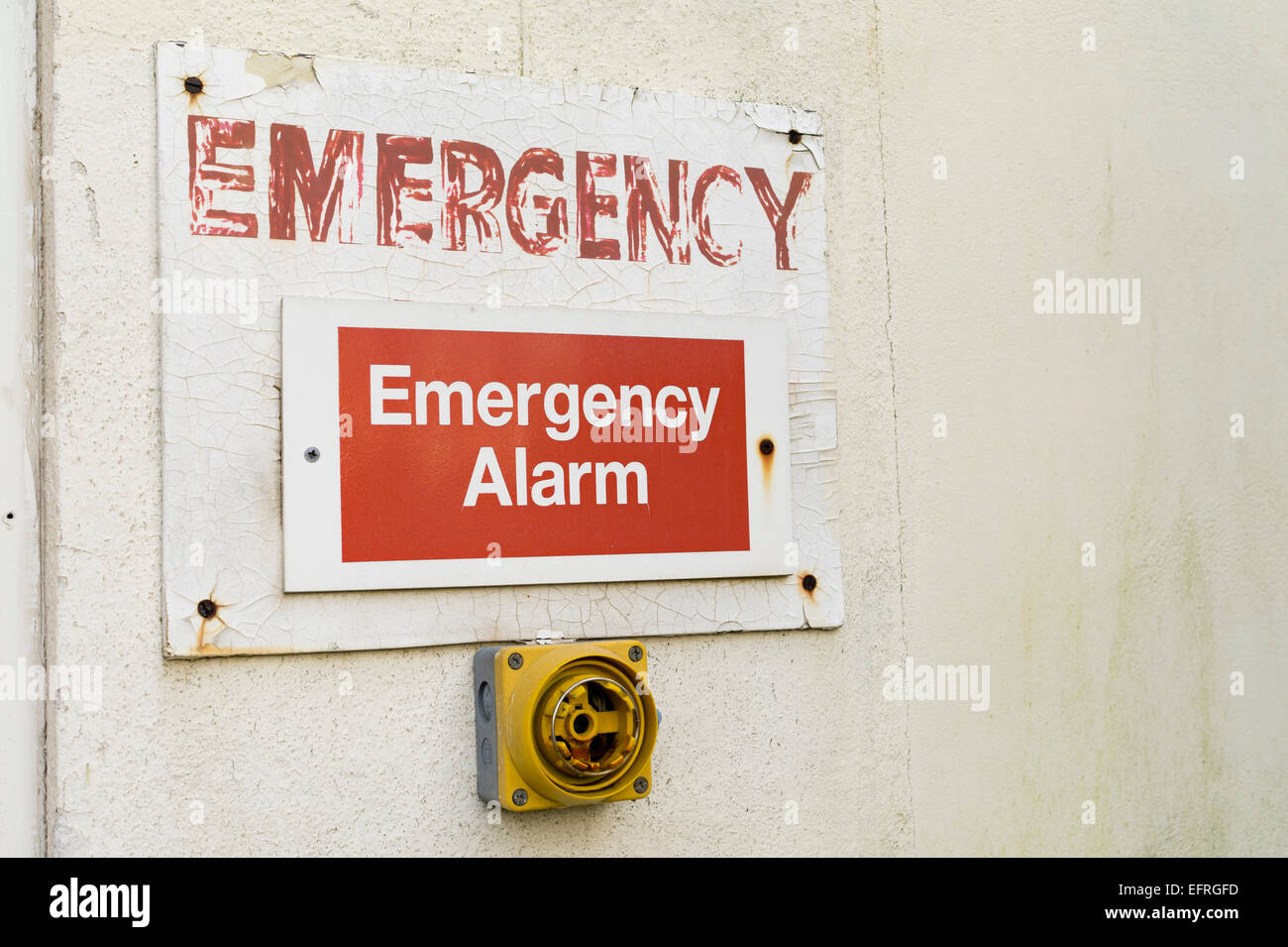 Broken emergency alarm at derelict premises Stock Photo