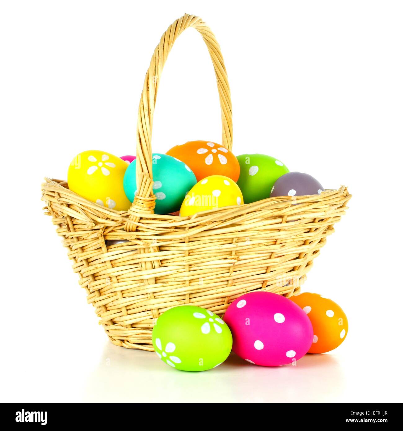 Easter basket filled with colorful eggs over a white background Stock ...