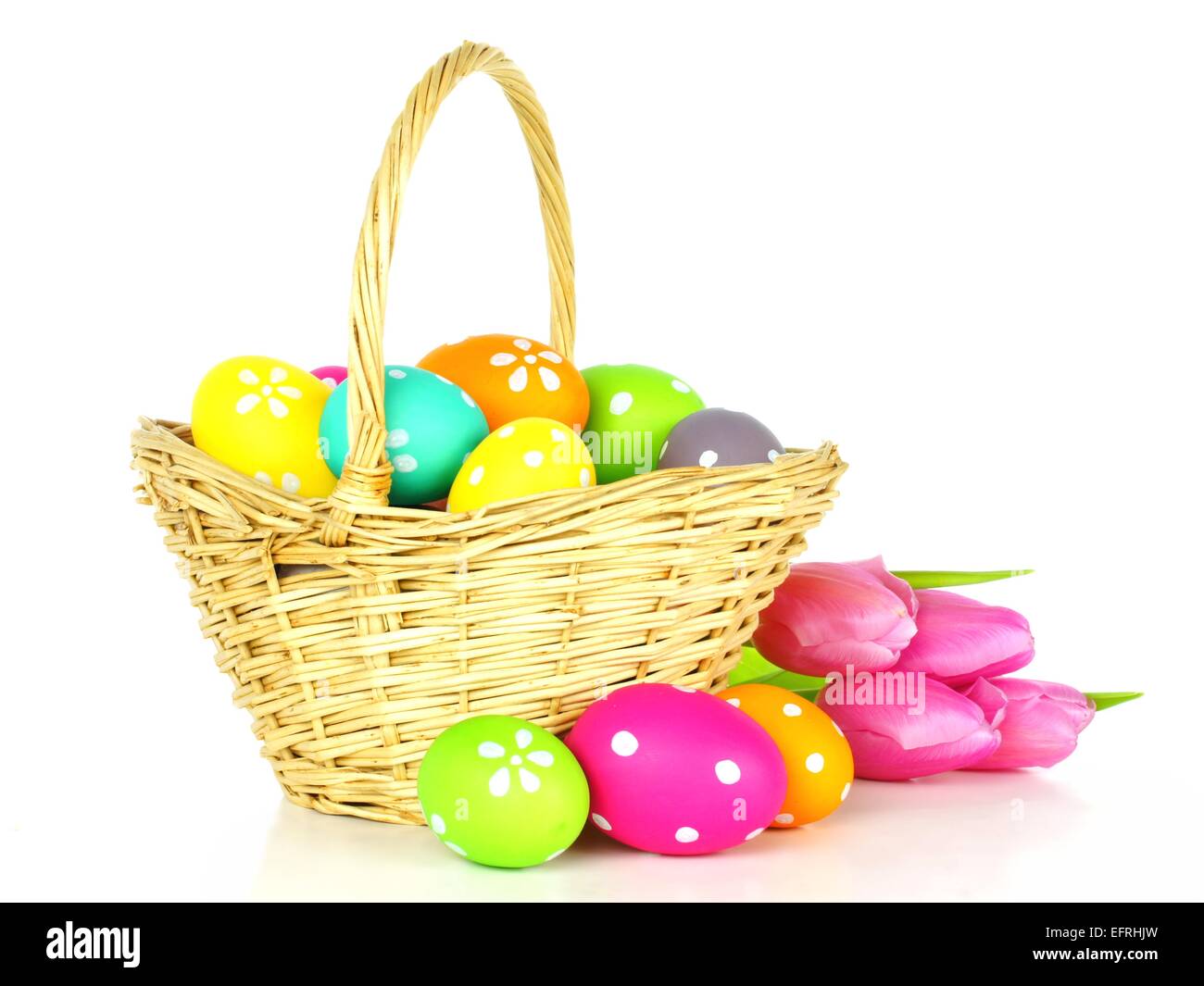 Easter basket filled with colorful eggs over a white background Stock ...