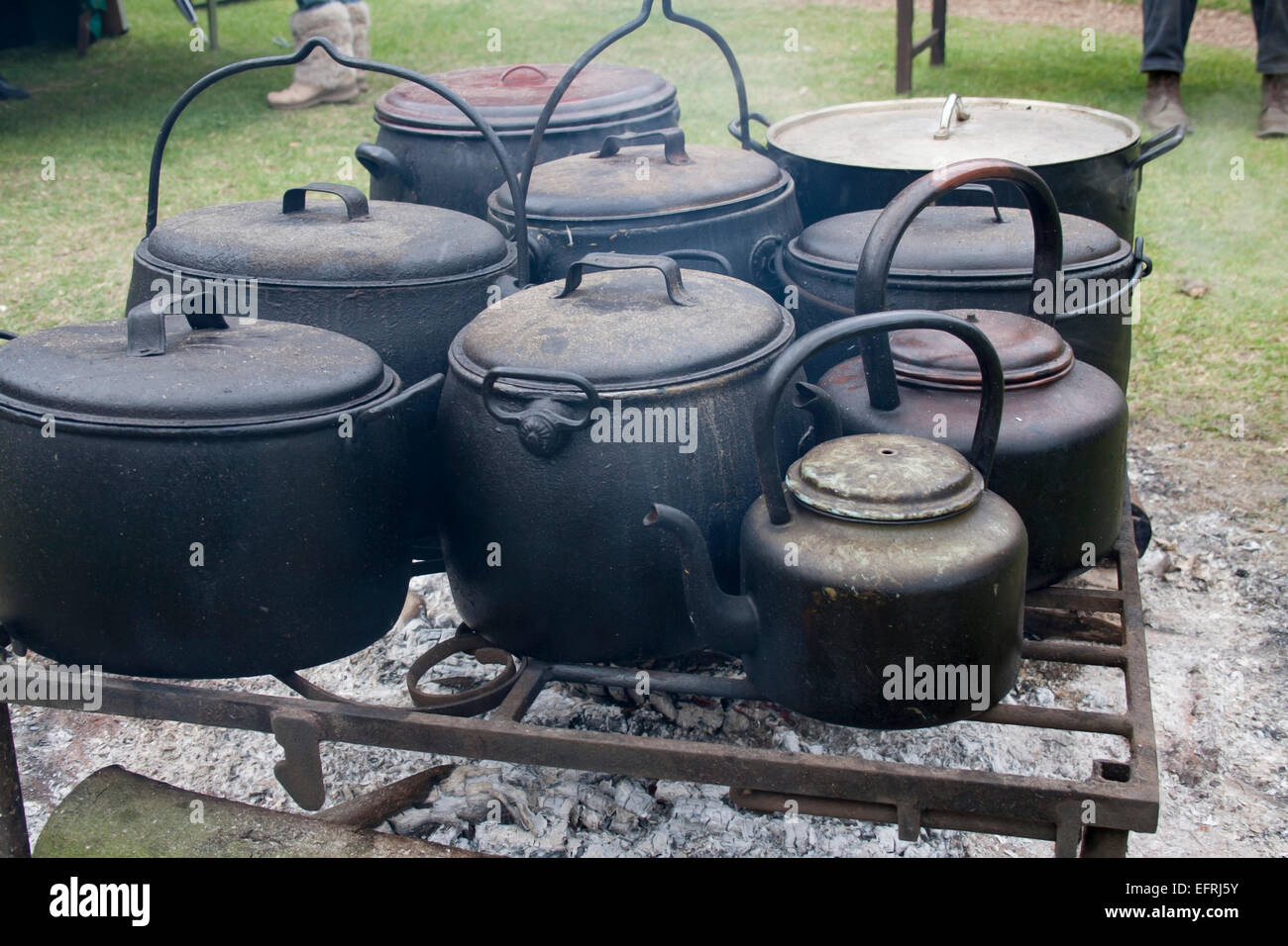 Cast Iron cooking pots over open fire Stock Photo - Alamy