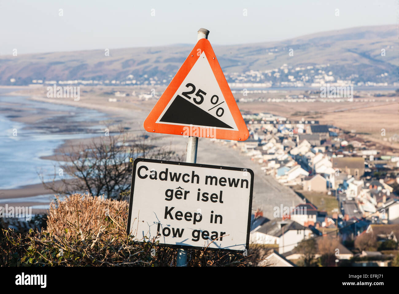 Steep hill,with slope at 25, down to holiday coastal village resort of