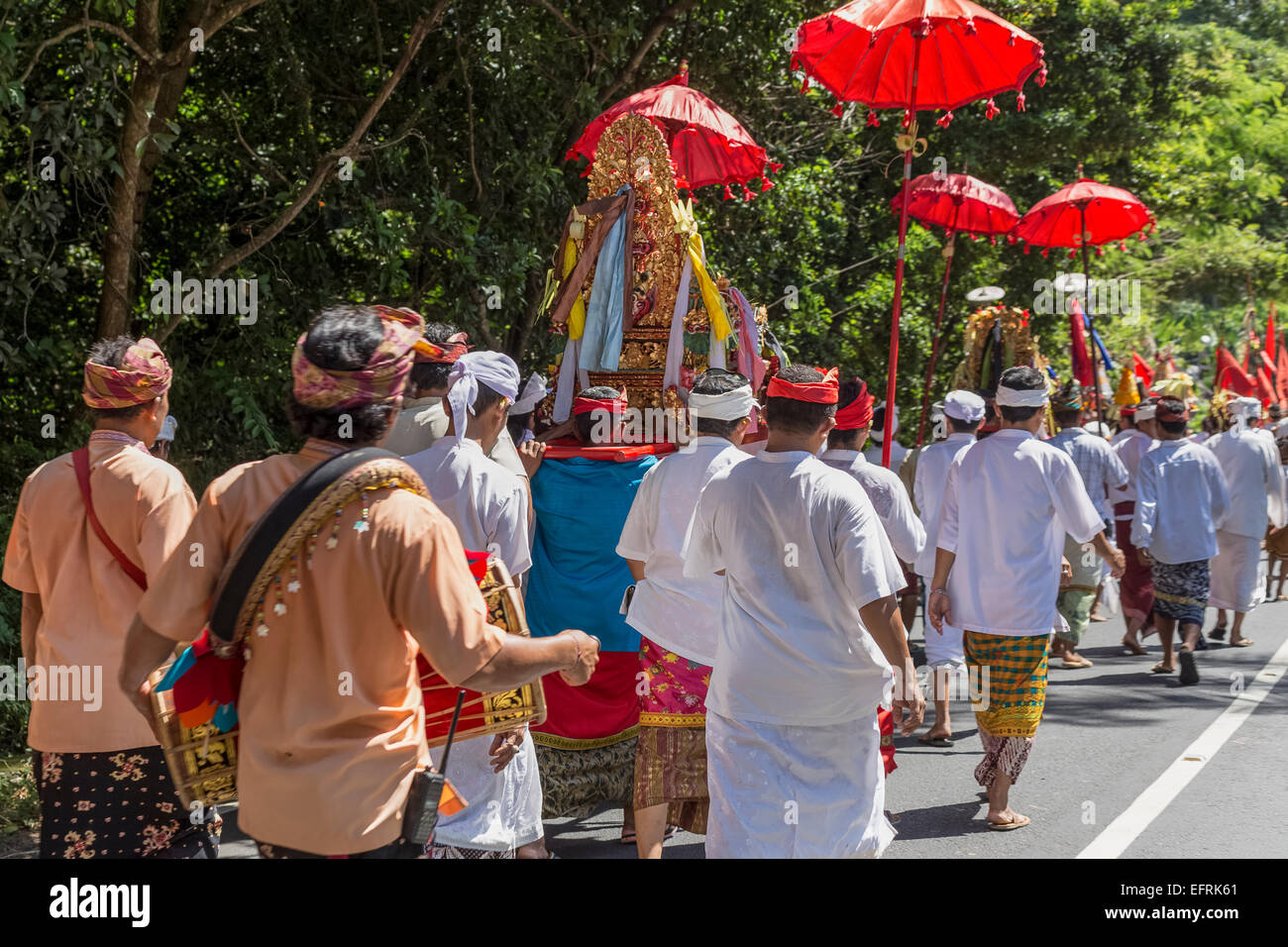 Men marching at festival in Bali, Indonesia Stock Photo