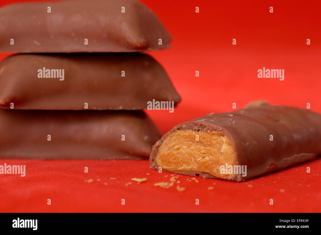 Unwrapped pieces of fun size Butterfinger candy. Stock Photo