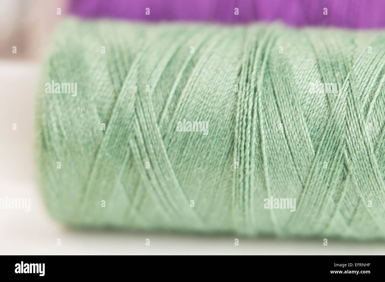 Sewing strings on a light background, macro shot, local focus Stock ...